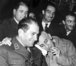 Mossadeq joking at trial with his legal aide, Colonel Shahqoli